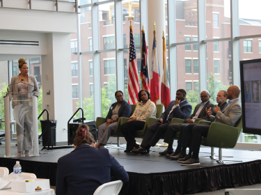 panel of people on a stage